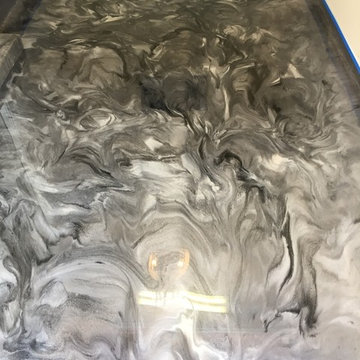 Grey pearl and black metallic epoxy garage floor