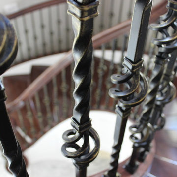Walnut Circular Stair with Twist & Basket Iron Balusters