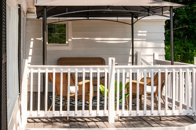 Example of a beach style home design design in Boston