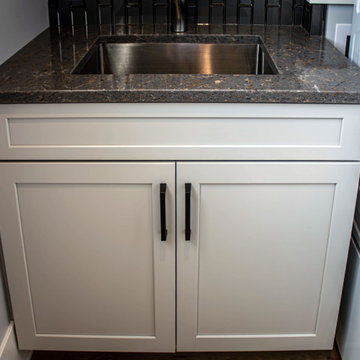 New Build - Laundry Room with Cool Gray  Cabinetry and Quartz Countertop