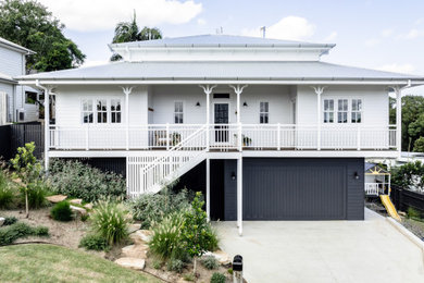 Mid-sized traditional two-storey exterior in Other.