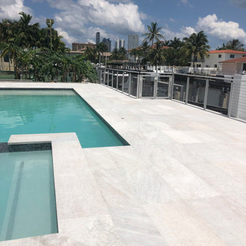 Pool deck with Snowhite Quartzite Floor and Wall Tiles