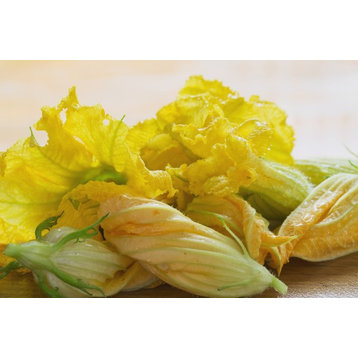 Close Up Of Zucchini Blossoms With Water Drops On Wooden Cutting Board; Calgary