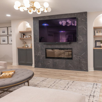 Warm & Inviting Basement Retreat with Custom Bar + Entertainment Center