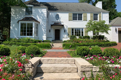 Design ideas for a large traditional front yard partial sun formal garden for summer in Chicago with a garden path and natural stone pavers.