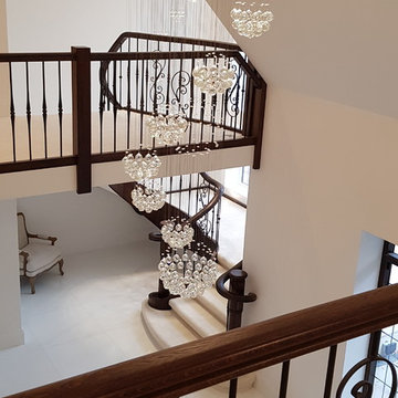 Oak Stained staircase with wrought iron spindles