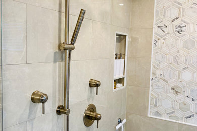 Example of a mid-sized classic master beige tile and porcelain tile porcelain tile, beige floor and double-sink bathroom design in Seattle with shaker cabinets, dark wood cabinets, beige walls, an undermount sink, quartz countertops, a hinged shower door, beige countertops and a built-in vanity