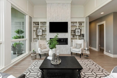 Living room - large transitional open concept porcelain tile living room idea in Other with white walls, a standard fireplace, a stone fireplace and a wall-mounted tv