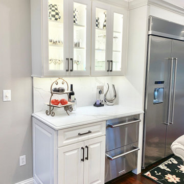 Ivory White Kitchen With Marble Look Quartz Counters and Splash