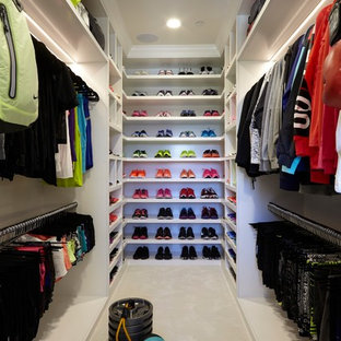 Trendy women's carpeted and white floor walk-in closet photo in Los Angeles with open cabinets and white cabinets