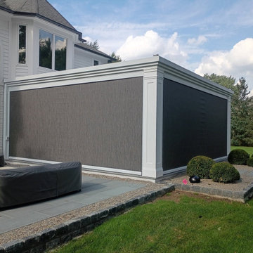 Custom column wrap trim on a motorized louvered pergola