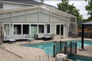 Pool Enclosure retracts over House