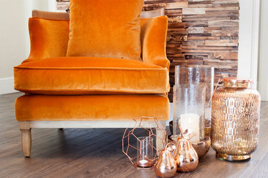 Velvet armchair and copper lanterns