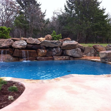 Custom Pool with Beach Entry and Large Waterfall