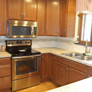 Kitchen Reconfigured to Brightens and Expand Storage