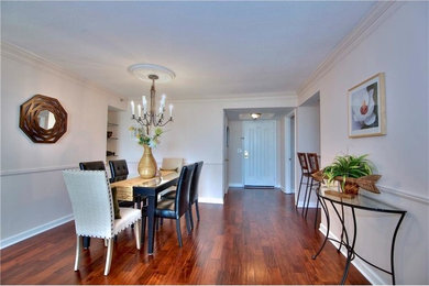 Mid-sized transitional dining room in Atlanta with beige walls and medium hardwood floors.