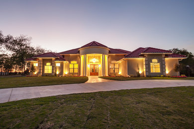 Photo of a large contemporary home design in Dallas.