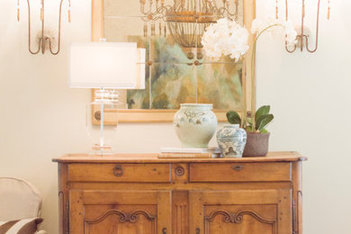 Inspiration for a mid-sized timeless dark wood floor foyer remodel in New Orleans with white walls