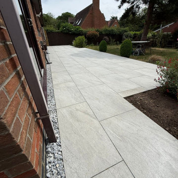 Porcelain Paving Following the Line of the House