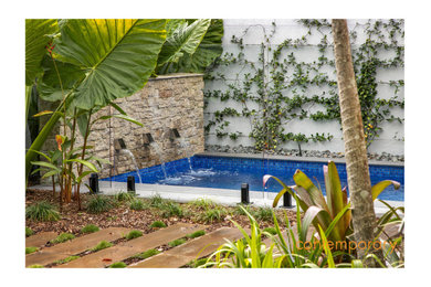 Inspiration for a small contemporary front yard custom-shaped pool in Sunshine Coast with with privacy feature.