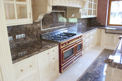 Photo of a traditional kitchen in Moscow with marble benchtops and with island.