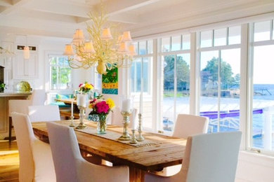 Example of a large beach style kitchen/dining room combo design in New York with white walls