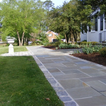 Using natural materials for a new walkway remains true to the style of this home