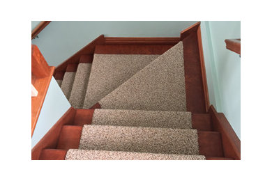 Staircase - transitional carpeted staircase idea in Other