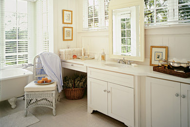 Inspiration for a country master bathroom in Other with an undermount sink, shaker cabinets, white cabinets, a claw-foot tub, beige tile and white walls.