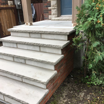 Masonry Stone Porch & Steps with Thin Veneer brick side Application.