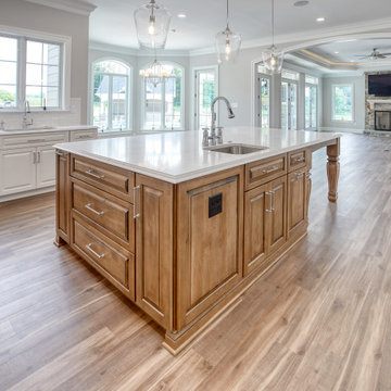 Transitional Kitchen with Two Toned Gathering Island & Archways