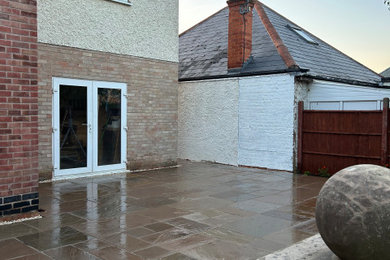 Natural Sandstone Patio Installation with Traditional Garden Features