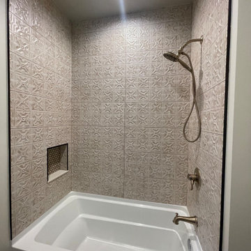 Unique Tub Surround with 12x36 beige deco tiles