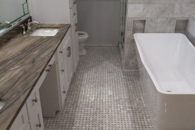 Bathroom - mid-sized modern white tile mosaic tile floor and white floor bathroom idea in Other with shaker cabinets, gray cabinets, a two-piece toilet, white walls, an undermount sink, quartzite countertops, a hinged shower door and gray countertops