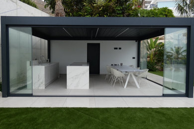 Inspiration for a mid-sized contemporary courtyard partial sun driveway for summer in Alicante-Costa Blanca with a garden path and concrete pavers.