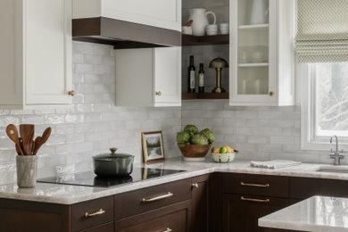 Example of a large transitional l-shaped porcelain tile and beige floor eat-in kitchen design in Philadelphia with an undermount sink, shaker cabinets, brown cabinets, quartzite countertops, white backsplash, porcelain backsplash, stainless steel appliances, an island and white countertops