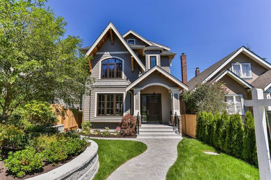 Mid-sized transitional three-storey brown exterior in Vancouver with a gable roof.