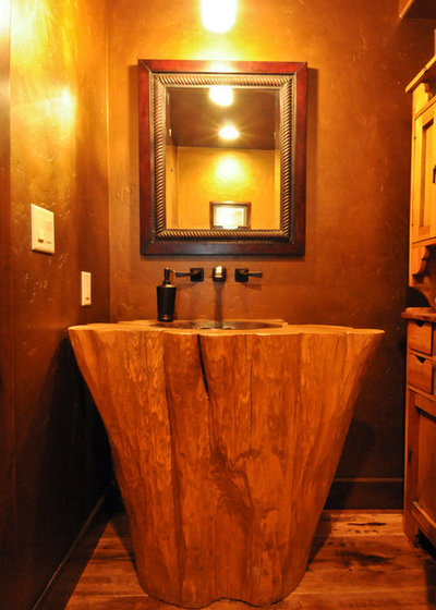 Rustic Powder Room by Mountain Log Homes of CO, Inc.