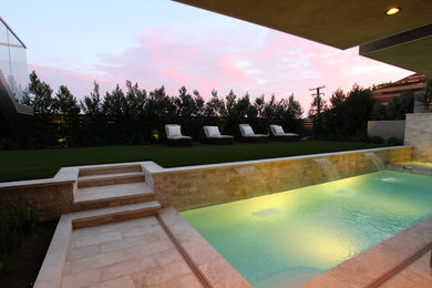 Inspiration for a contemporary pool remodel in Orange County