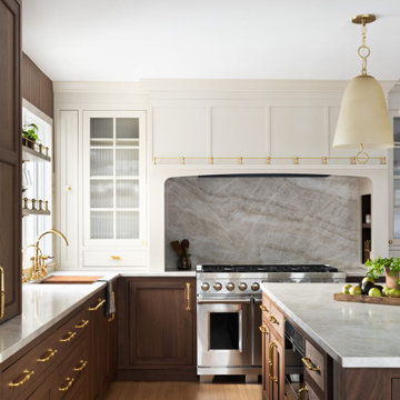 Luxury Transitional Kitchen with Walnut Cabinetry, Marble Slab Backsplash & Bras