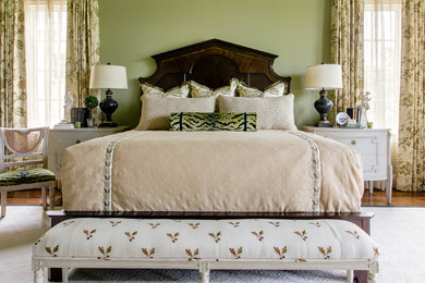 Inspiration for a master bedroom in Nashville with green walls.