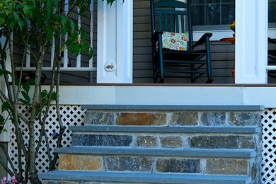 Mid-sized tuscan side yard patio photo in New York with decking and a roof extension
