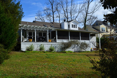 Inspiration for a mid-sized timeless white one-story wood exterior home remodel in Wilmington with a shingle roof