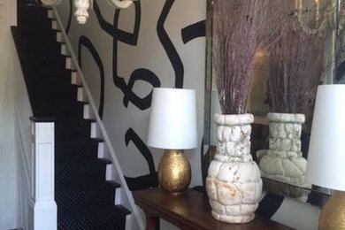 Example of a large transitional dark wood floor hallway design in DC Metro with white walls