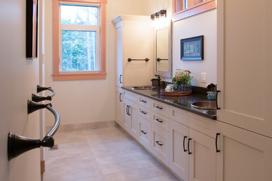 Inspiration for a transitional bathroom in Vancouver with shaker cabinets, beige cabinets and quartzite benchtops.