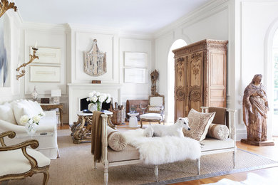 Large transitional open concept medium tone wood floor and brown floor living room photo in New Orleans with brown walls, a standard fireplace and a wood fireplace surround