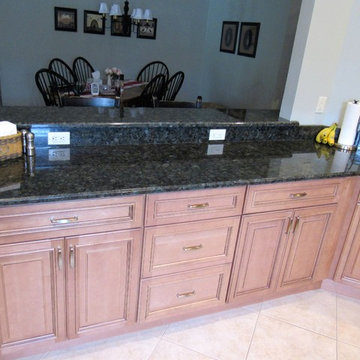 Galaxy Pecan cabinets with peacock green granite