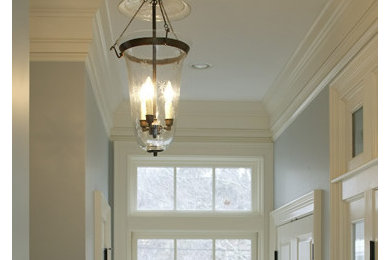 Inspiration for a mid-sized traditional hallway in Boston with blue walls.