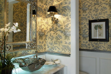 Inspiration for a large timeless 3/4 white tile and porcelain tile porcelain tile and multicolored floor bathroom remodel in Houston with raised-panel cabinets, distressed cabinets, a one-piece toilet, yellow walls, a vessel sink and onyx countertops