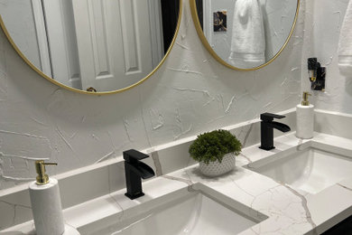 Minimalist kids' double-sink bathroom photo in Dallas with raised-panel cabinets, black cabinets, an undermount sink, quartz countertops, white countertops and a built-in vanity